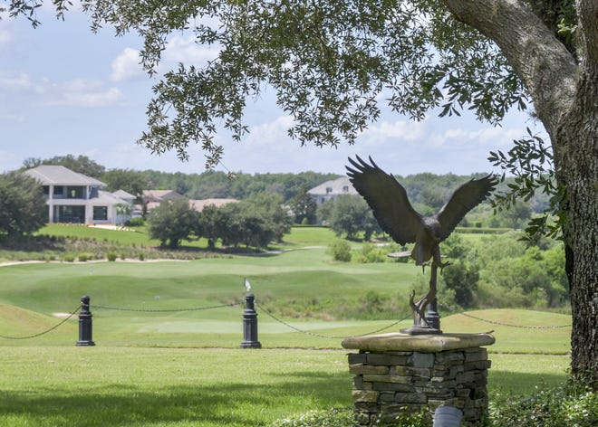 A statue of a red-tailed hawk sits by the clubhouse at the RedTail community in Sorrento on Friday. Residents of the communities of Serenity at Red Tail and Sorrento Springs are fighting Eustis' annexation request, as they want to remain rural and avoid paying higher property taxes. [PAUL RYAN / CORRESPONDENT]