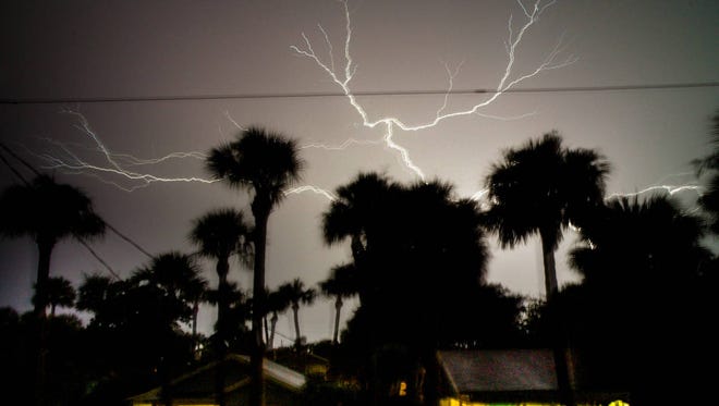 A storm over Atlantic Beach flashes lightning in the clouds on July 11, 2014. (Bob Mack/The Florida Times-Union)