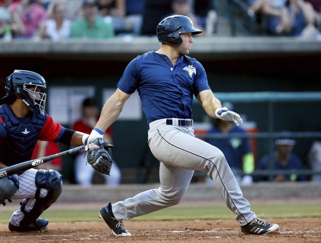 Tim Tebow hits a single for the Columbia Fireflies during a game against the Charleston RiverDogs at Joseph P. Riley Jr. Park in Charleston S.C. on June 16. Tebow has been promoted to the New York Mets' high Class A affiliate in St. Lucie. (Michael Pronzato/The Post And Courier via AP)