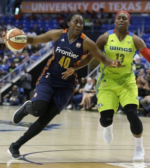 Sun guard Shekinna Stricklen, left, scored 13 points Sunday but the Sun had their five-game winning streak snapped with a 96-82 loss to the Wings. [THE ASSOCIATED PRESS]