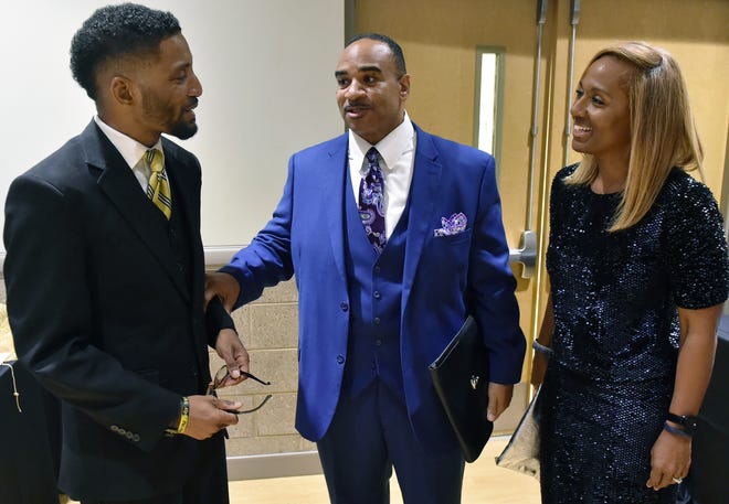 Barett Brown, President of the Alamance County NAACP, welcomes Dr. Sir Walter Mack Jr. of Union Baptist Church, Winston-Salem, with his wife Kim Mack to the 43rd annual Freedom Fund Banquet at Elon Community Church. [Robert Thomason / Times-News]