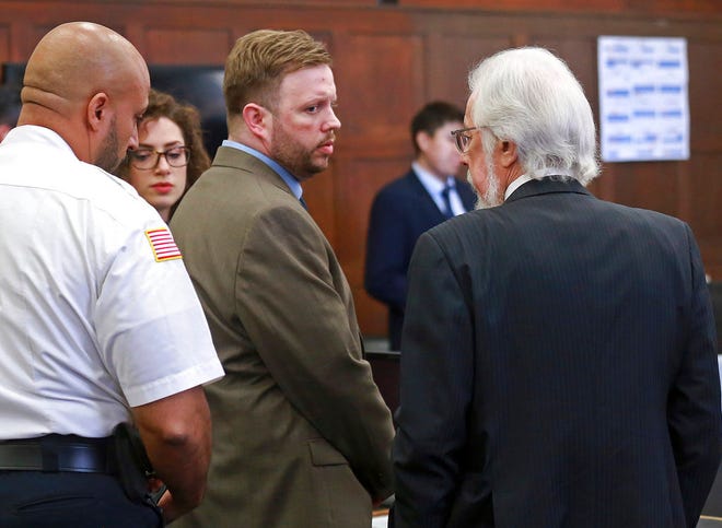 Defendant Michael P. McCarthy looks at his attorney Jonathan Shapiro after a guilty of second degree murder against him at Suffolk Superior Court on Monday, June 26, 2017. McCarthy was convicted Monday of second-degree murder in the death of Bella Bond, a 2-year-old girl who became known as Baby Doe after her remains washed up on the shores of a Boston Harbor island. (Matt West/The Boston Herald via AP, Pool)