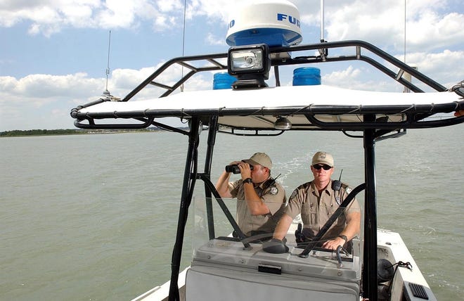 Florida Fish and Wildlife Conservation Commission officers will patrol the state's waterways from Friday through July 4 in Operation Dry Water, with a goal of reducing injuries and deaths attributed to impaired boating. [AP Photo]