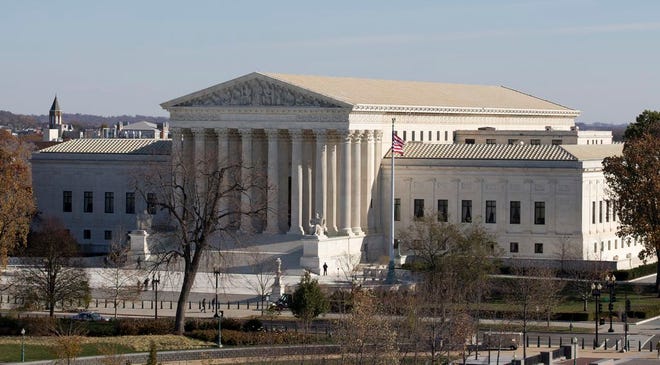 This Nov. 18, 2014, file photo shows the U.S. Supreme Court in Washington, as seen from the roof of the U.S. Capitol. (AP Photo/Carolyn Kaster, File)