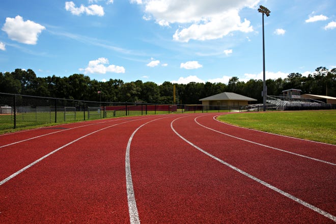 Oak Hall is the only school with a rubber track, pictured, in Alachua County. Every Alachua County public school track is surfaced with asphalt. The School Board will host a workshop July 20 to discuss the pros and cons of each material. [Andrea Cornejo/ Staff photographer]
