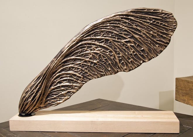 "Samara," cast bronze on maple base, by Rory Mahon