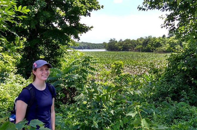 Jessica Kraus, fellow with the Heritage Conservancy, stands in front of the Bristol Marsh Nature Preserve. Through August, Kraus will be reaching out to residents and businesses to educate them on the marsh, as well as encourage them to visit and help protect the ecological feature.