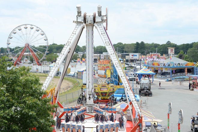 Workers prepare the Brockton Fair on Tuesday, June 28, 2017. The Fair opens on June 29 till July 9th.