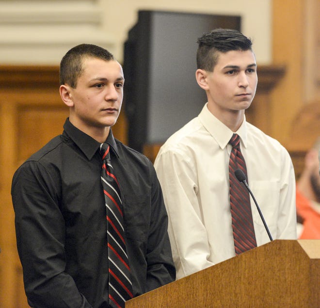 Jonas E. Rohr (left) and Kyle L. Bodager appear before Stark County Common Pleas Judge Frank Forchione on Monday for sentencing. Both previously pleaded guilty to a charge of discharge of a firearm on or near prohibited premises. A bullet struck Merle Webb in the face. (CantonRep.com / Michael Balash)