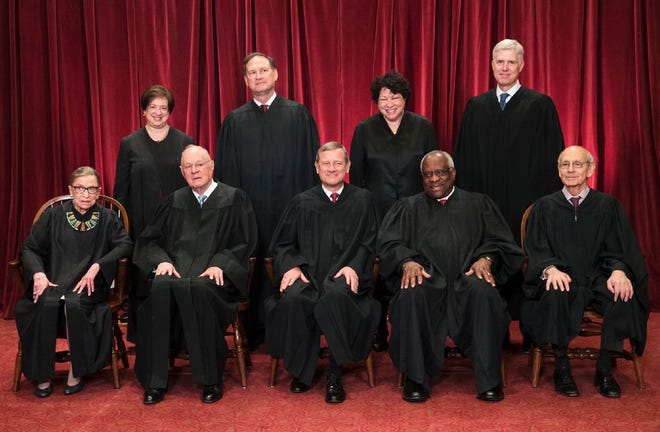 The justices of the U.S. Supreme Court gather for an official group portrait to include new Associate Justice Neil Gorsuch, top row, far right, Thursday. June 1, 2017, at the Supreme Court in Washington. Seated, from left are: Justice Ruth Bader Ginsburg, Justice Anthony Kennedy, Chief Justice John Roberts, Justice Clarence Thomas and Associate Justice Stephen Breyer. Standing, from left are: Justice Elena Kagan, Justice Samuel Alito, Justice Sonia Sotomayor and Associate Justice Neil Gorsuch.