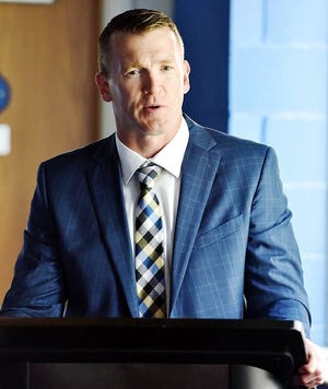 Trent Cull, the new head coach of the Utica Comets, speaks Wednesday at the Utica Memorial Auditorium. [SARAH CONDON/OBSERVER-DISPATCH]