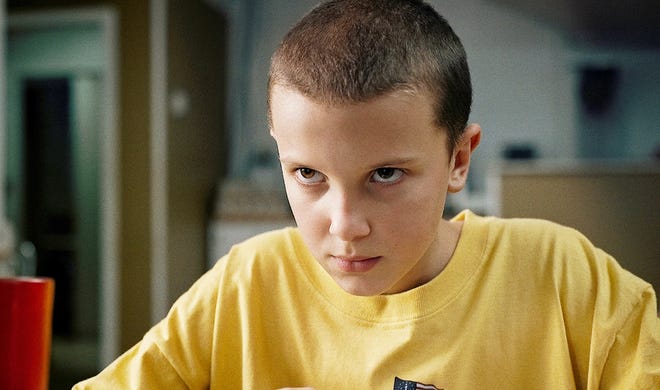 This image released by Netflix shows Millie Bobby Brown in a scene from “Stranger Things.” Brown portrays Eleven, who can move things with her mind and is the fascinating secret friend of a group of pre-teen boys in the fictional town of Hawkins, Ind. [NETFLIX/ASSOCIATED PRESS]