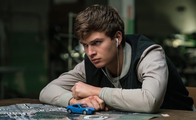Baby (Ansel Elgort) listens to tunes while worrying about his future. [Sony Pictures]