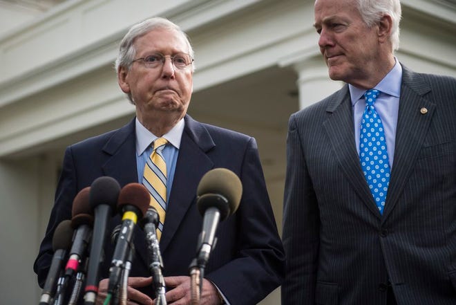 Senate Majority Leader Mitch McConnell of Ky., left, and Senate Majority Whip Sen. John Cornyn, R-Texas, speak with reporters outside of the White House after they and other Senate Republicans had a meeting with President Trump on Tuesday.