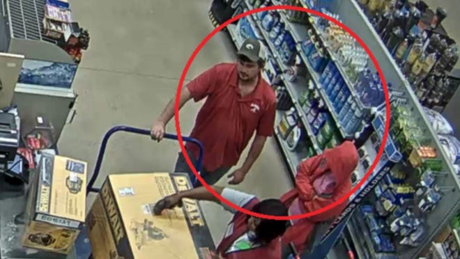 The Tuscaloosa Police Department released surveillance footage of a man and a woman using the credit card at the Lowe's store in Northport on May 23. [Surveillance photo]