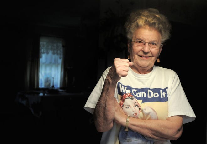 (File) Mae Krier stands in her Bristol Township home in December 2014. Krier was a Rosie the Riveter, helping build B-17s and B-29s for Boeing in Seattle from 1943 to 1945. She also riveted aircraft at the Kaiser plant in Bristol during the Korean War.