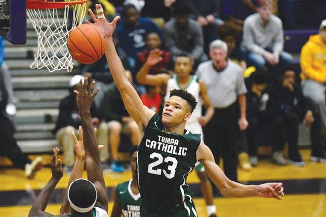 When Kevin Knox, seen here going up for a block during the John Wall Invitational in December 2016, tweeted he was going to Kentucky, the twitterverse wasn't so supportive.