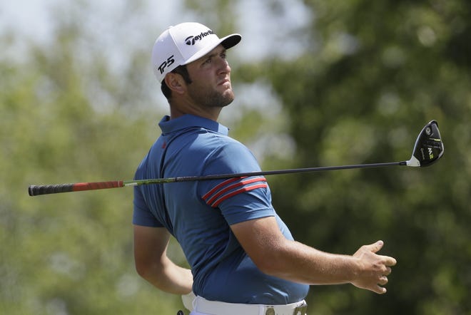 Jon Rahm, of Spain, drops his club after his drive on the fourth hole during the second round of the U.S. Open golf tournament Friday at Erin Hills in Erin, Wis. Rahm's early success as a pro has brought scheduling conflicts. [AP Photo / David J. Phillip]