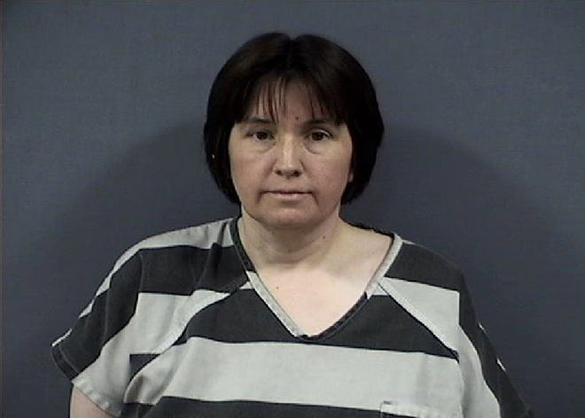 This undated photo released by the Monroe County Sheriffs Office shows Sherri Richter. Richter is accused of trying to torch a car with her 11-year-old son bound and locked inside at a southeast Michigan cemetery. The Monroe County sheriff's office said 48-year-old Richter was arraigned Thursday, June 29, 2017, on assault with intent to murder and arson charges. (Monroe County Sheriffs Office via AP)