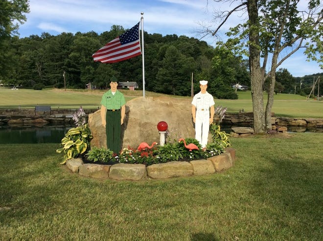 A display honoring the military has been added to a pond on Wolf Run Road in Dennison for Fourth of July. PHOTO PROVIDED
