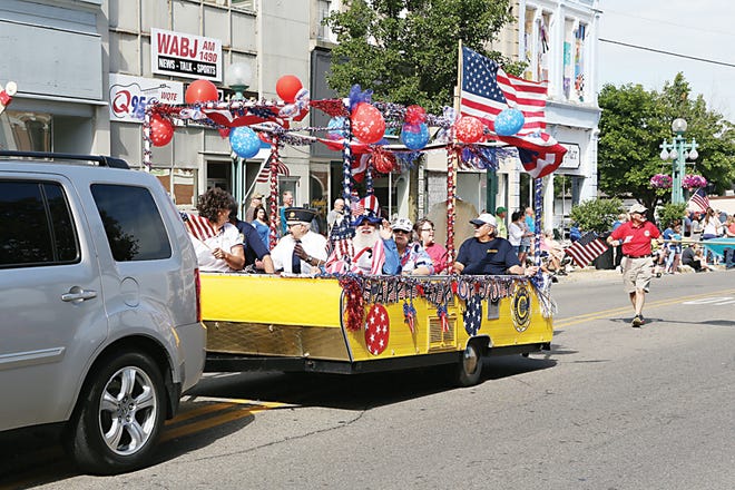 People ride in the Civitan of Lenawee float in Adrian’s 2016 Fourth of July parade.