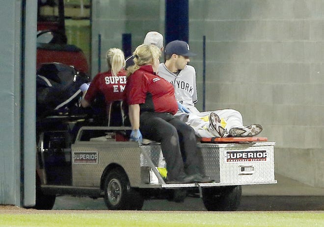 New York Yankee Dustin Fowler is taken off the field after he was injured during the first inning of Thursday's game against the Chicago White Sox.      

[Nam Y. Huh/AP]