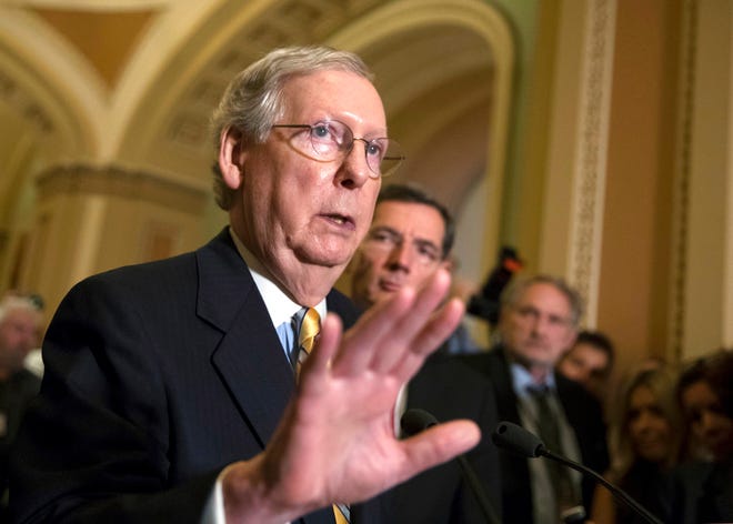 Senate Majority Leader Mitch McConnell, R-Ky., joined by Sen. John Barrasso, R-Wyo., right, tells reporters he is delaying a vote on the Republican health care bill while the GOP leadership works toward getting enough votes, at the Capitol in Washington, Tuesday, June 27, 2017. (AP Photo/J. Scott Applewhite)