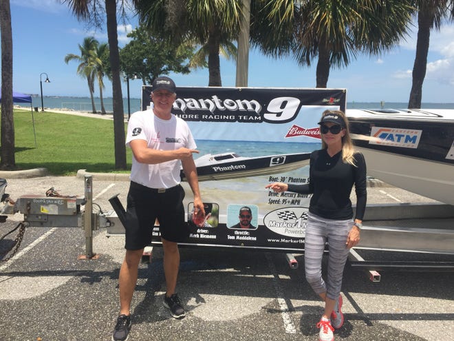 Mark Niemann and his wife, Kim, the Phantom 9 team manager, stand next to their boat at Centennial Park in Sarasota on Thursday. [HERALD-TRIBUNE PHOTO / JOHN DOWLING]