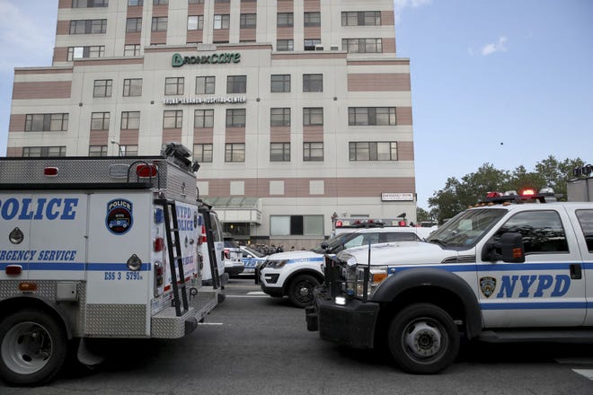 Police vehicles converge on Bronx Lebanon Hospital in New York after a gunman opened fire there on Friday, June 30, 2017. The gunman, identified as Dr. Henry Bello who used to work at the hospital, apparently took his own life after shooting others, authorities said.