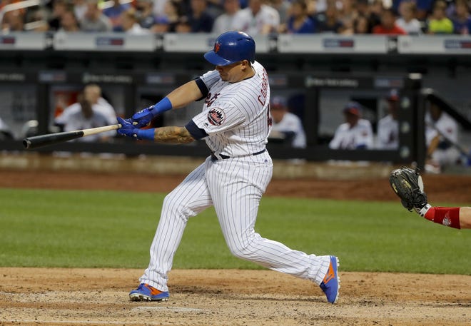 New York Mets' Asdrubal Cabrera (13) connects for a two-run home run against the Philadelphia Phillies during the seventh inning on Saturday. [AP Photo/Julie Jacobson]