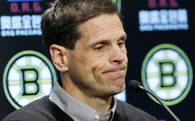 Boston Bruins general manager Don Sweeney pauses during a news conference in February. He signed two minor free agents to one-year deals on Saturday, the first day of free agency. [Michael Dwyer/The Associated Press]