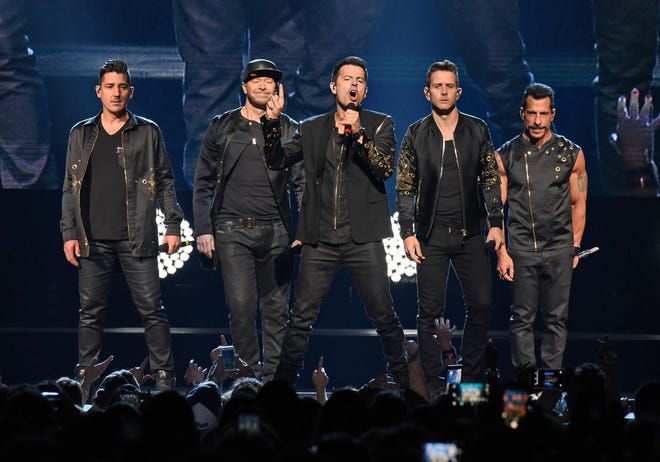 New Kids on The Block line up for one of their opening songs Saturday at a full-house PPG Paints Arena.