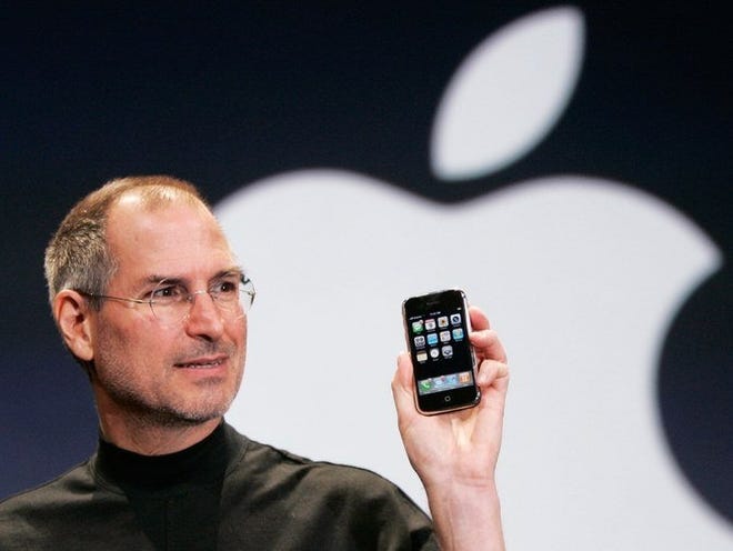 Steve Jobs is shown introducing the first Apple iPhone in this 2007 file photo. [Associated Press]