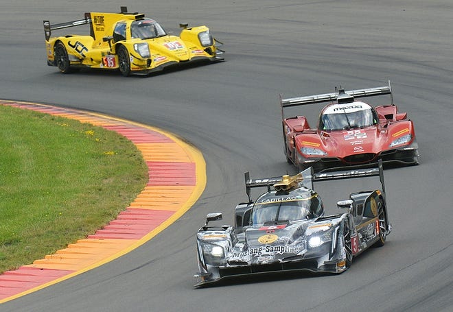Joao Barbosa leads a pack of prototypes through the toe of the boot during the Sahlen's Six Hours at the Glen Sunday at Watkins Glen International. [ERIC WENSEL/THE LEADER]