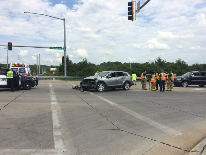 The driver of a silver SUV ran a red light at S.W. 37th and Kansas Ave., causing a four-vehicle crash on Sunday. (Katie Moore/The Capital-Journal)