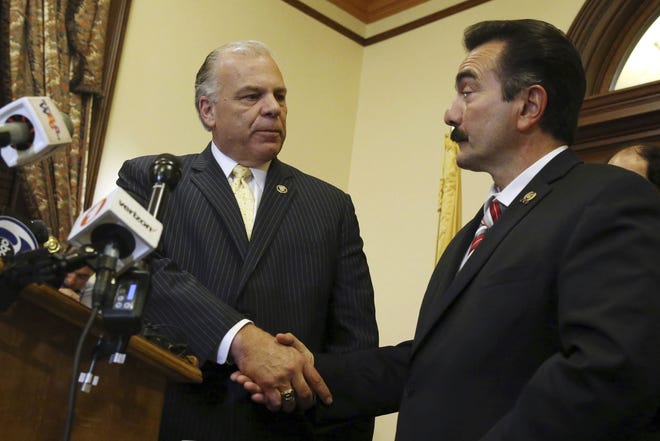 New Jersey Senate President Steve Sweeney (left), D-West Deptford, and New Jersey Democratic Assembly Speaker Vincent Prieto, D-Secaucus, shake hands as they announce an agreement to end the New Jersey budget impasse Monday, July 3, 2017, in Trenton.