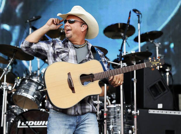 Garth Brooks performs during the Oklahoma Twister Relief Concert, benefiting victims of the May 2013 tornadoes, at Gaylord Family - Oklahoma Memorial Stadium on the campus of the University of Oklahoma in Norman, Okla., Saturday, July 6, 2013. Photo by Nate Billings, The Oklahoman Archives