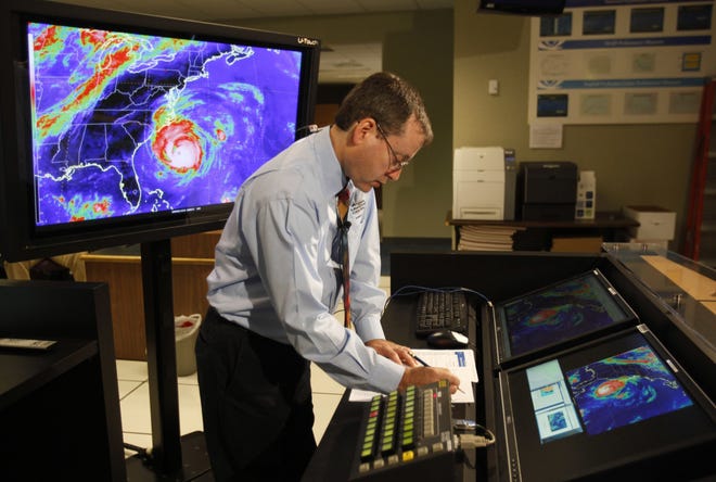 In this Sept. 2, 2010, file photo, Chief hurricane forecaster James Franklin prepares for a live update on Hurricane Earl at the National Hurricane Center in Miami. Franklin, a retiring chief of the hurricane specialist unit at the National Hurricane Center in Miami says further cuts to tropical weather research threaten to undermine recent improvements in hurricane intensity forecasts. [LYNNE SLADKY/AP FILE PHOTO]