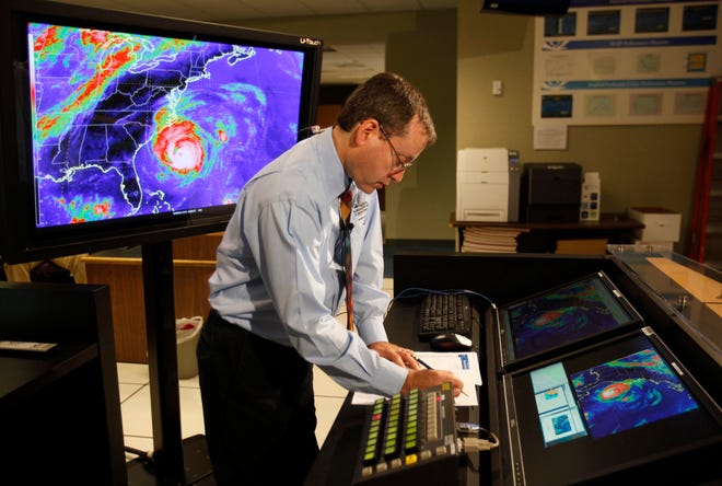 Chief hurricane forecaster James Franklin prepares for a live update on Hurricane Earl in 2010 at the National Hurricane Center in Miami. Franklin, a retiring chief of the hurricane specialist unit at the National Hurricane Center in Miami, says further cuts to tropical weather research threaten to undermine recent improvements in hurricane intensity forecasts. [LYNNE SLADKY/ASSOCIATED PRESS FILE PHOTO]