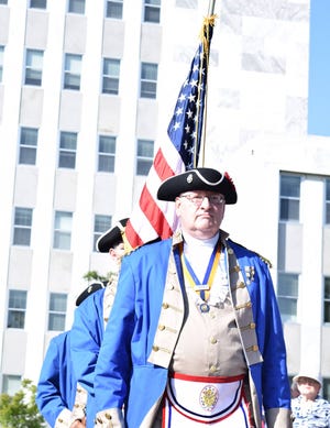 Thom Davies leads the National Sojourners during the presentation of the colors at Tuesday’s Fourth of July Ceremony. The event honored the three Georgia signers of the Declaration of Independence and local historian Erich Frazier shared the story of Elijah Clarke. AMANDA KING/STAFF