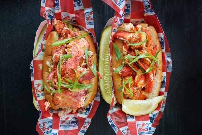 Lobster rolls from the Red Hook Lobster Pound food truck. At left is a Maine-style roll served cold with lemon mayo, and at right is one served Connecticut-style, hot with butter. [The Washington Post / Deb Lindsey]