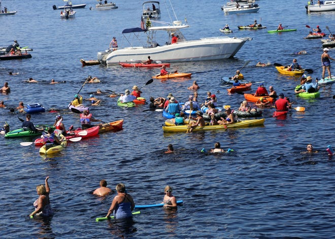The 26th annual Freedom Swim begins on the north shore of the Peace River in Port Charlotte and ends at Fishermen's Village in Punta Gorda. [HERALD-TRIBUNE PHOTO / BETSY WILLIAMS]