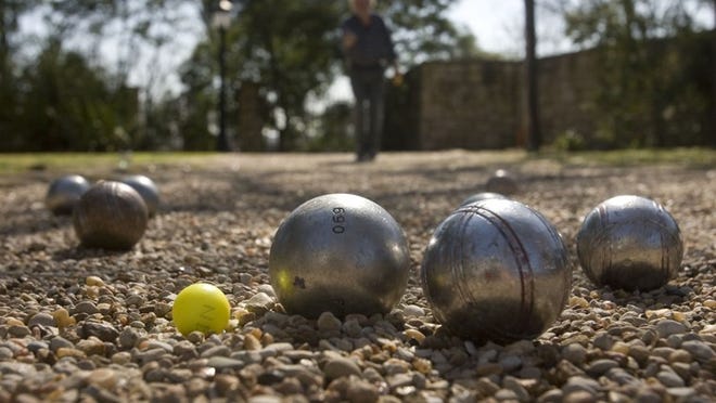Play the classic French lawn game pétanque at the Alliance Française of Austin’s 22nd Annual Bastille Day Party. AMERICAN-STATESMAN 2010