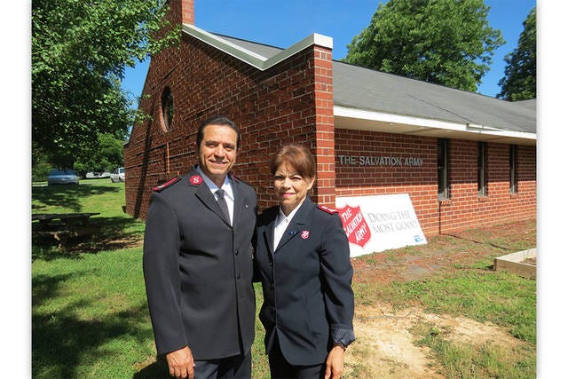 NEW LEADERSHIP — The Salvation Army Corps moved Majors Luis and Lucy Viera from El Paso, Texas, to Asheboro in January. Their charge was to make a radical improvement in the Randolph County unit and its ability to provide local services. Both are educators and pastors and have been with the Corps for 25 years. They are seen here in front of the Salvation Army church, at the corporate office at 345 N. Church Street, in Asheboro. (Greta Lint / The Courier-Tribune)