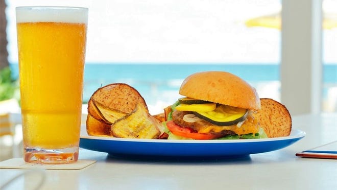 At Eau Palm Beach Resort’s Breeze Ocean Kitchen, a $20.17 lunch special include a double beef brisket burger, choice of side dish and a craft beer. Courtesy of Eau Palm Beach