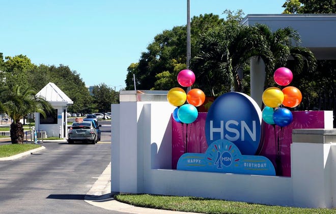This photo shows a sign outside of the headquarters of the Home Shopping Network on Thursday, July 6, 2017, in St. Petersburg, Fla. QVC's parent company is taking control of the Home Shopping Network for about $2.6 billion in stock to create what they say will be the third-largest e-commerce company in the United States. (Scott Keeler/Tampa Bay Times via AP)