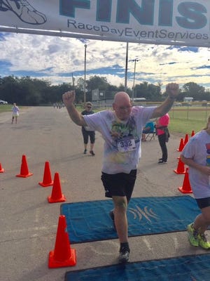 Formerly paralyzed after two back surgeries, Jeffrey Moore of Stephenville crossed the finish line at the Education Foundation's FK Color Run last week. Moore largely credits his recovery to the help of Dr. Joe Priest and the volunteer physical therapists at the Lab for Wellness and Motor Behavior at TSU.