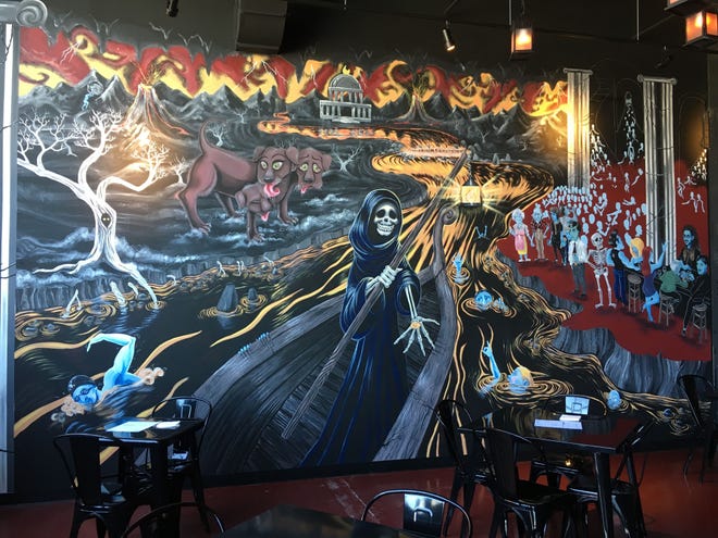 A mural on the wall at the River Styx Brewing Company in Fitchburg has a theme based on the Greek myth about the ferryman taking souls to the Underworld.[Daily News Staff Photo/Norman Miller]