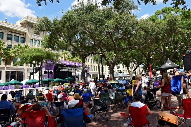 Fans took advantage of the shade in Hemming Park as they listened to the music on the Groovin’ Stage. On Sunday May 28, 2017 the final day of the free Jacksonville Jazz Festival was staged in Downtown Jacksonville, FL. The festival featured three stages for music and The Terry Parker High School Combo Band was joined by concert goers sporting color parasols in a New Orleans style Second Line Jazz Parade from Monroe and Laura streets through downtown before returning to Hemming Park. (Bob Mack/Florida Times-Union)