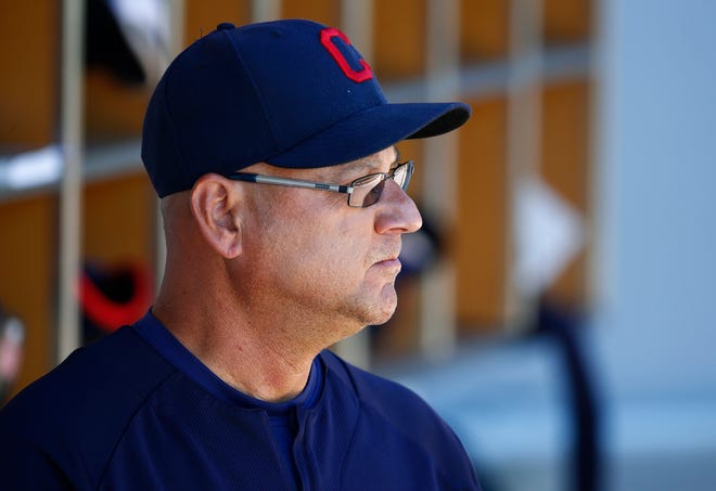 FILE - In this March 24, 2017, file photo, Cleveland Indians manager Terry Francona pauses in the dugout prior to the team's spring training baseball game against the Chicago Cubs in Mesa, Ariz. Francona remained hospitalized Thursday, July 6, with no clear timetable for his return. Francona spent his third straight day at the Cleveland Clinic, where he has been undergoing tests — and possibly a procedure — to resolve the causes of him becoming light-headed over the past month. The 58-year-old was hospitalized twice last month and doctors admitted him Tuesday, about one week after he began wearing a heart monitor. (AP Photo/Ross D. Franklin, File)